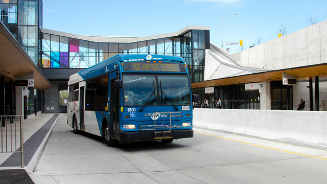 A Mississauga Transit MiWay bus departs from a Mississauga BRT station