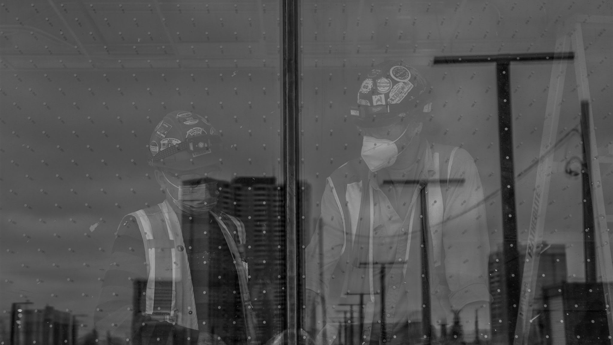 people looking out of a window.