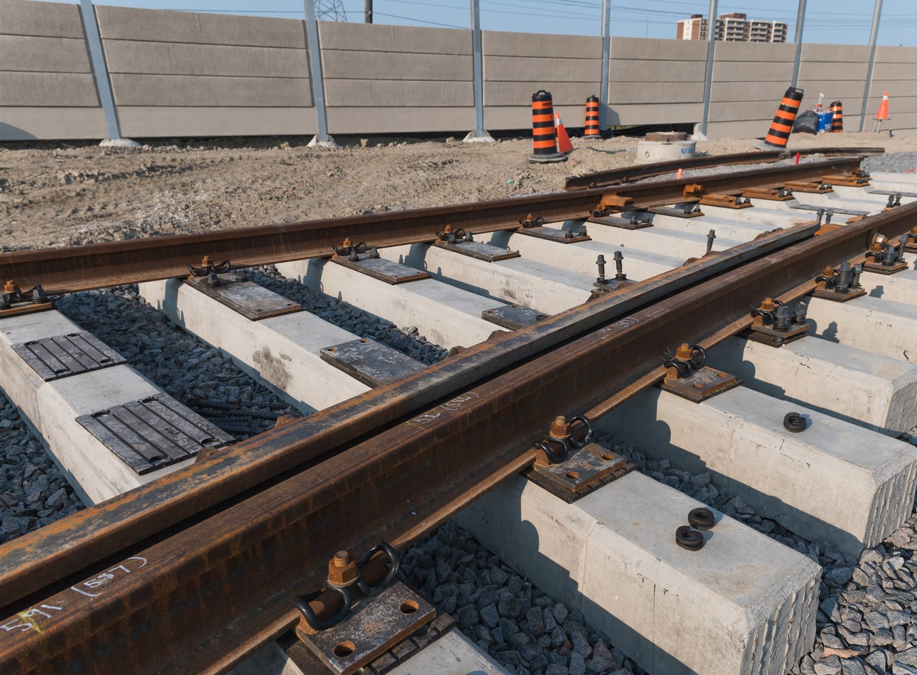 a line of new rails on concrete support.