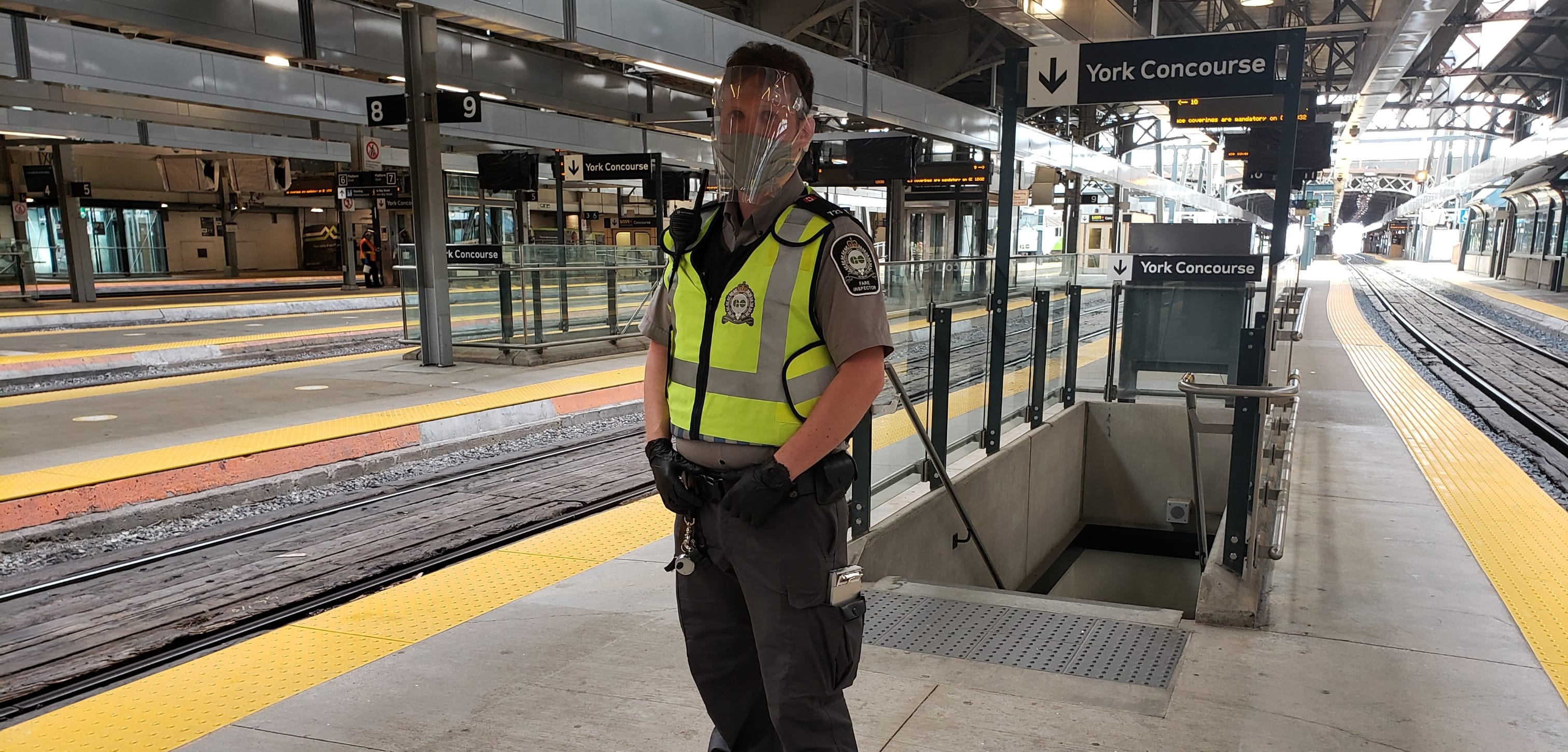 GO Transit fare inspector with face coverings, face shields, gloves