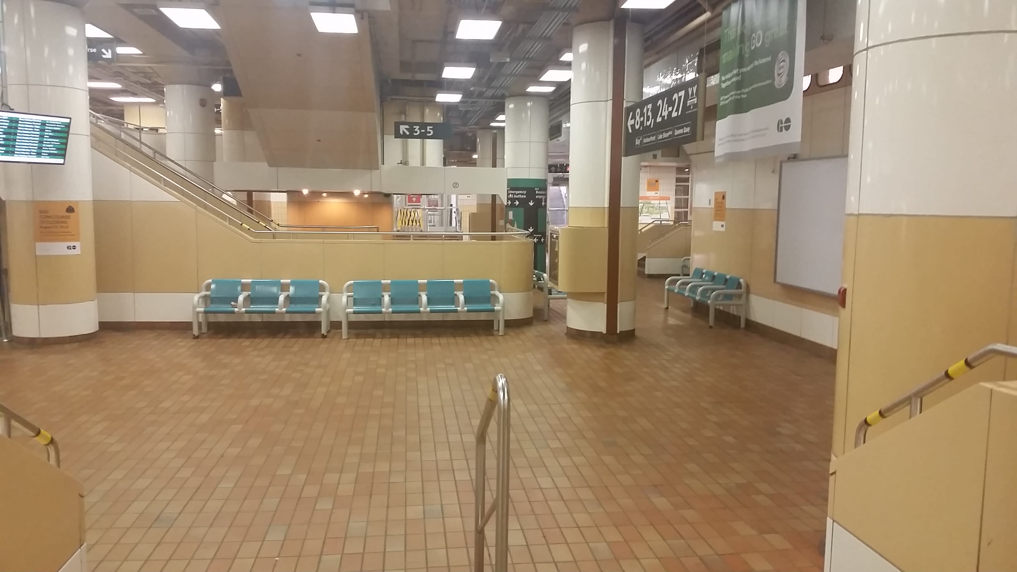 the old, brown tiles and green seats of the Old Bay Concourse.