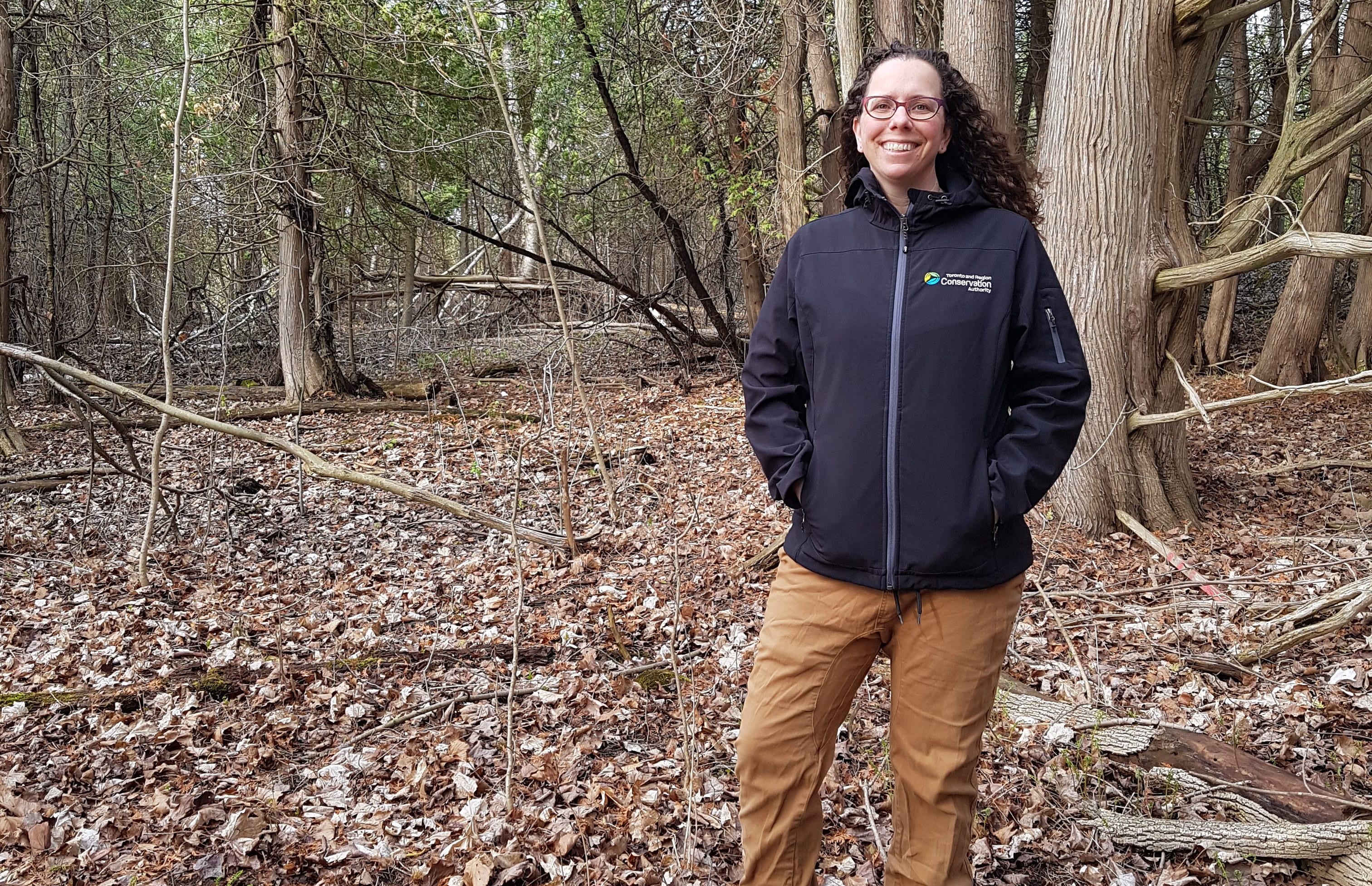 TRCA employee Kelly Jamieson in a forest