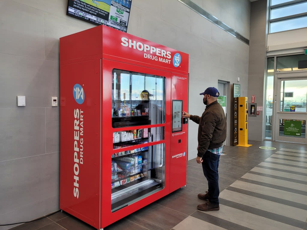 a man beside the vending machine.