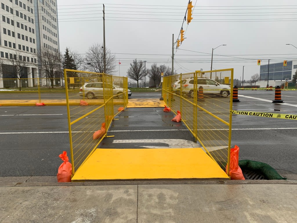 a crosswalk with barriers on both sides.
