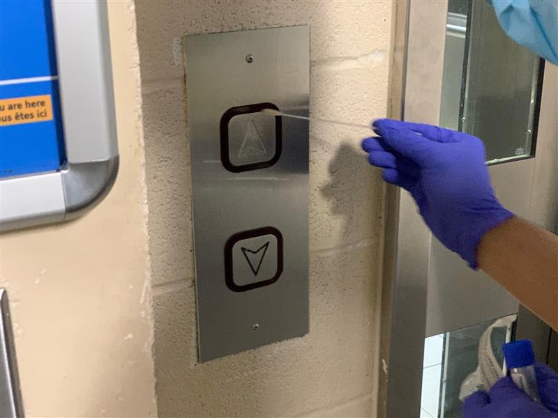 a sample being taken of elevator buttons.