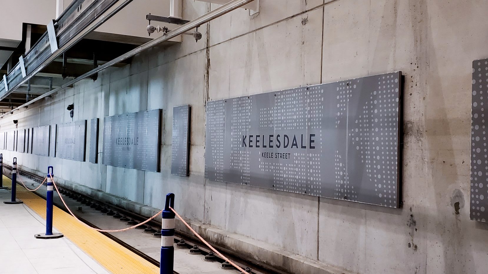 photo from the train platform in Keelesdale station showing a sign with the station name