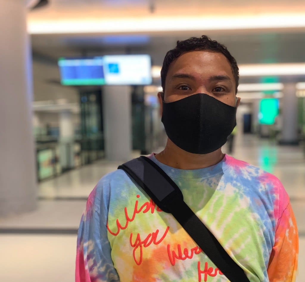 a customer standing in the Bay Concourse.
