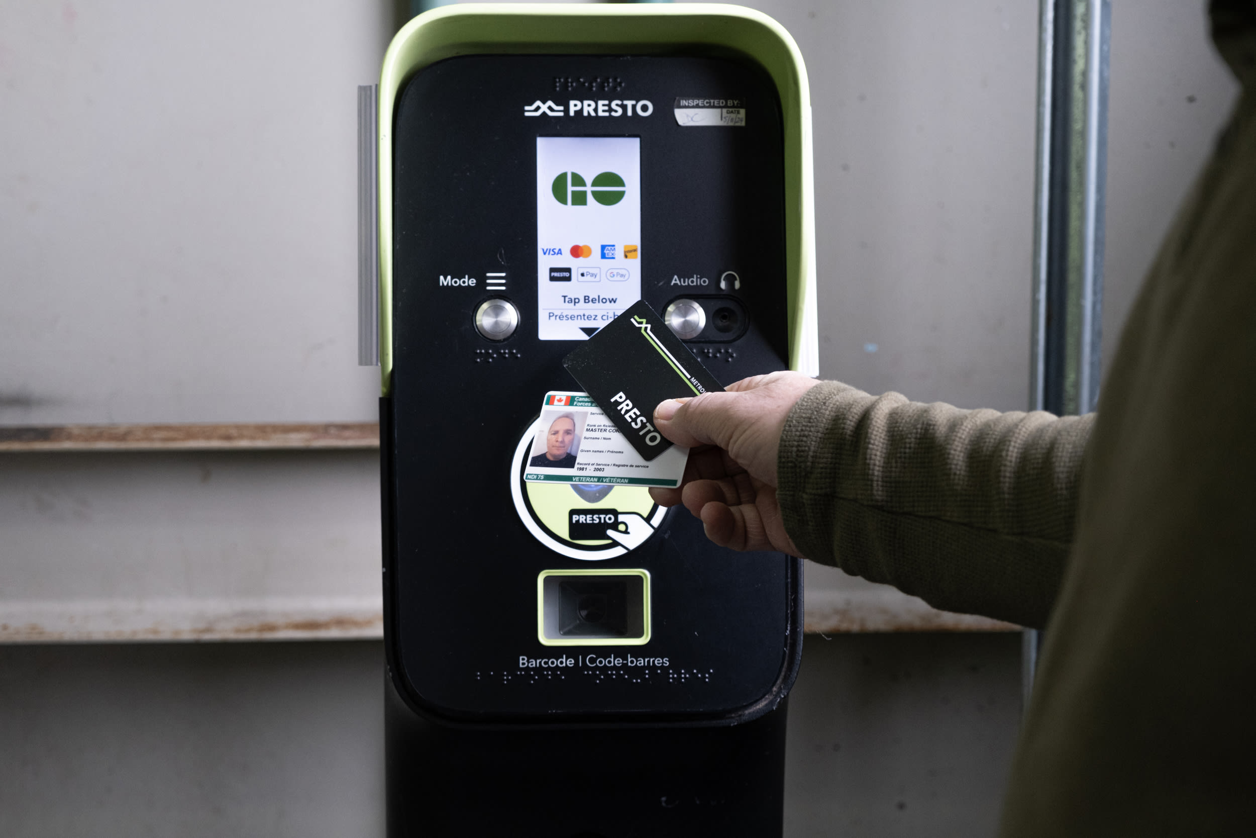 Veterans riding GO Train with PRESTO Card