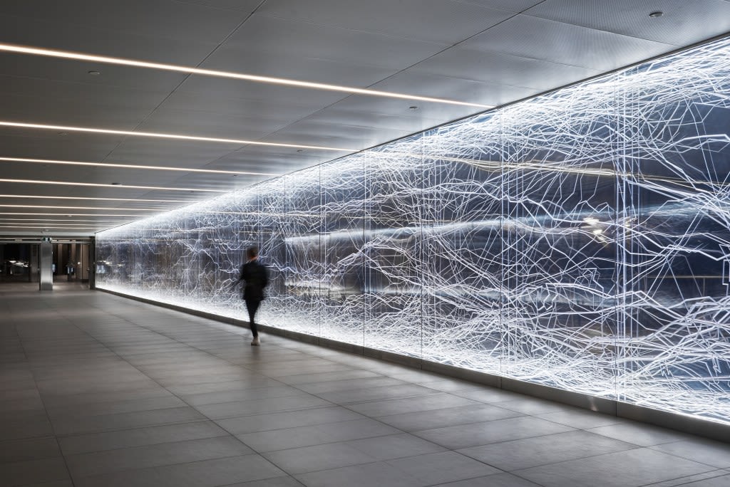 the artwork as a pedestrian walks by