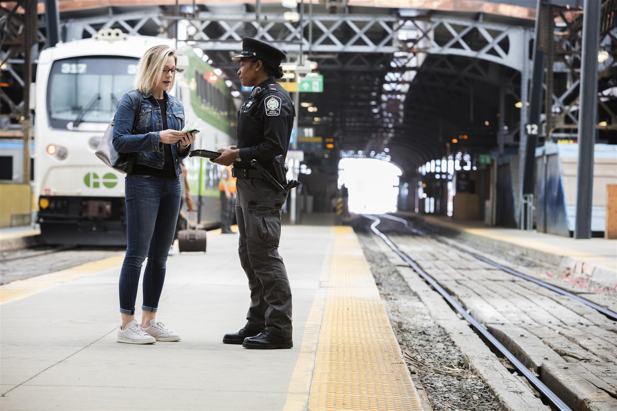 An officer interacts with a customer