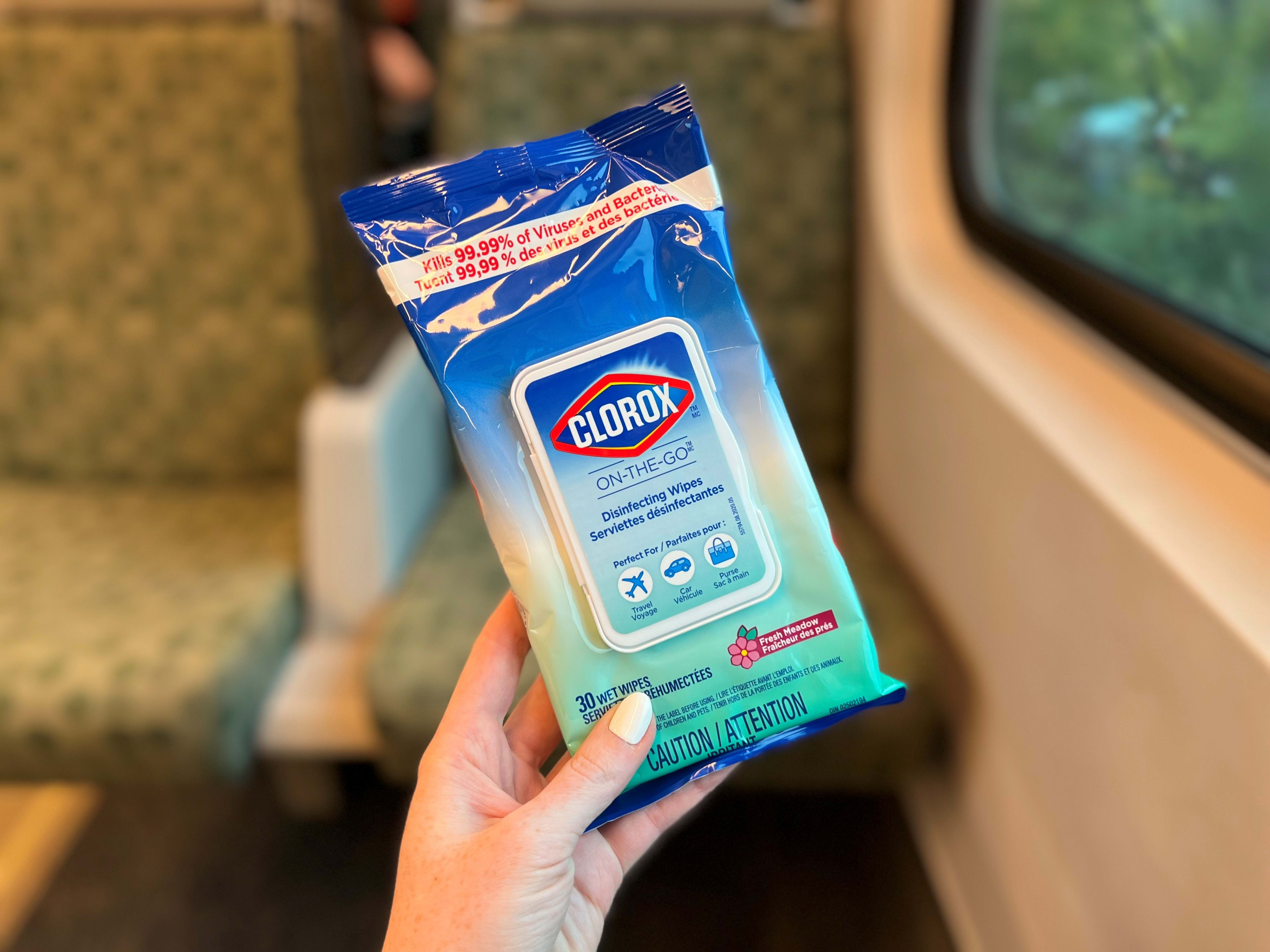 wipes being held in a hand.