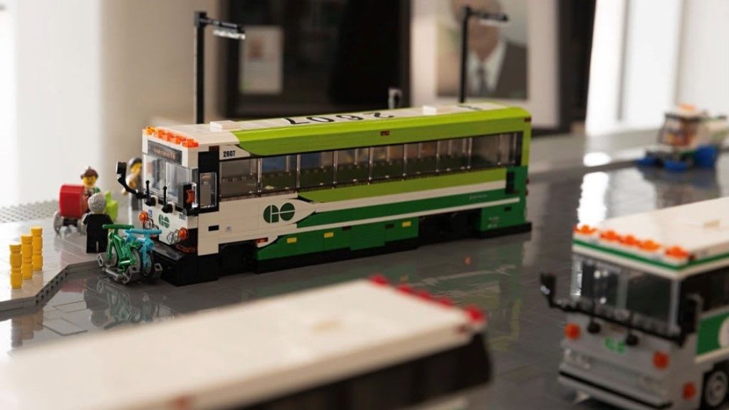 LEGO GO buses sit in model GO bus terminal