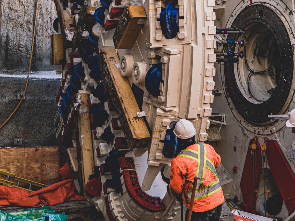 January 2022: The cutterheads are lowered into the launch shaft site and attached to the front of...