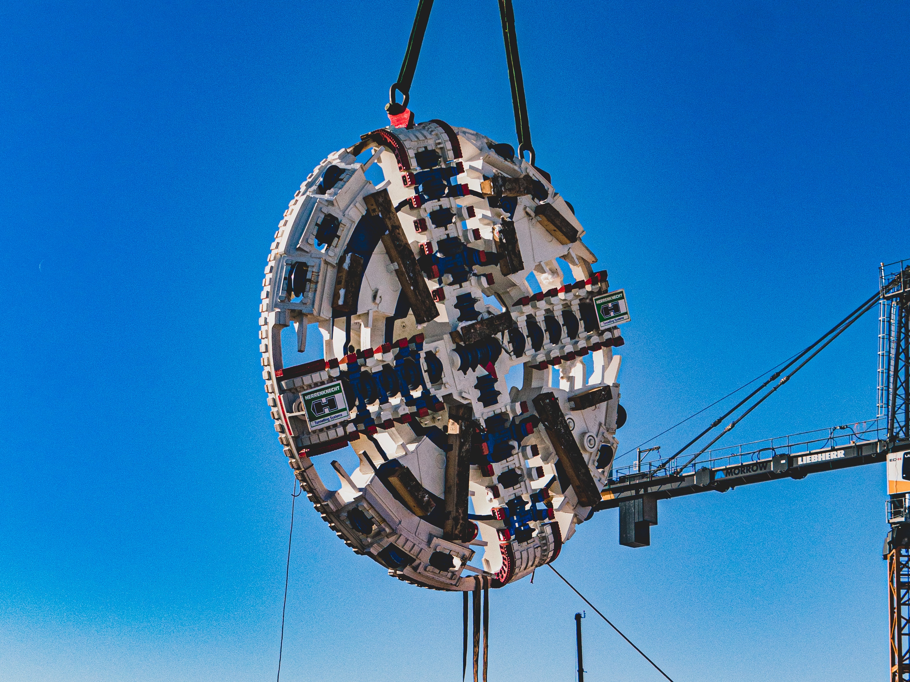 January 2022: The cutterheads are lowered into the launch shaft site and attached to the front of...