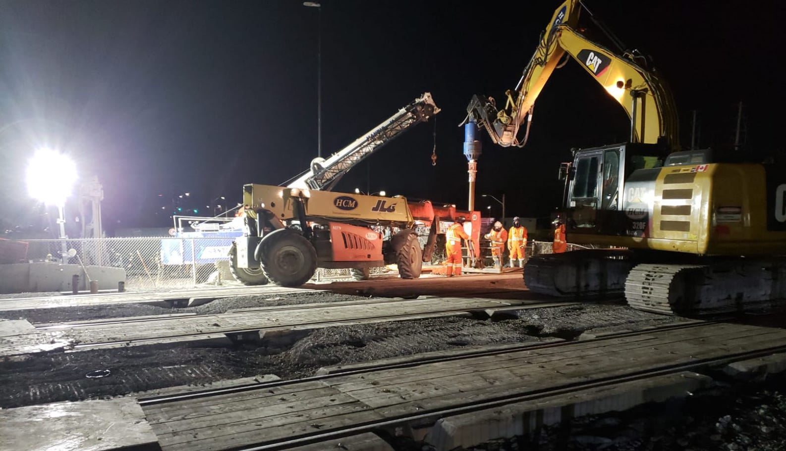 A work crew is drilling micropiles