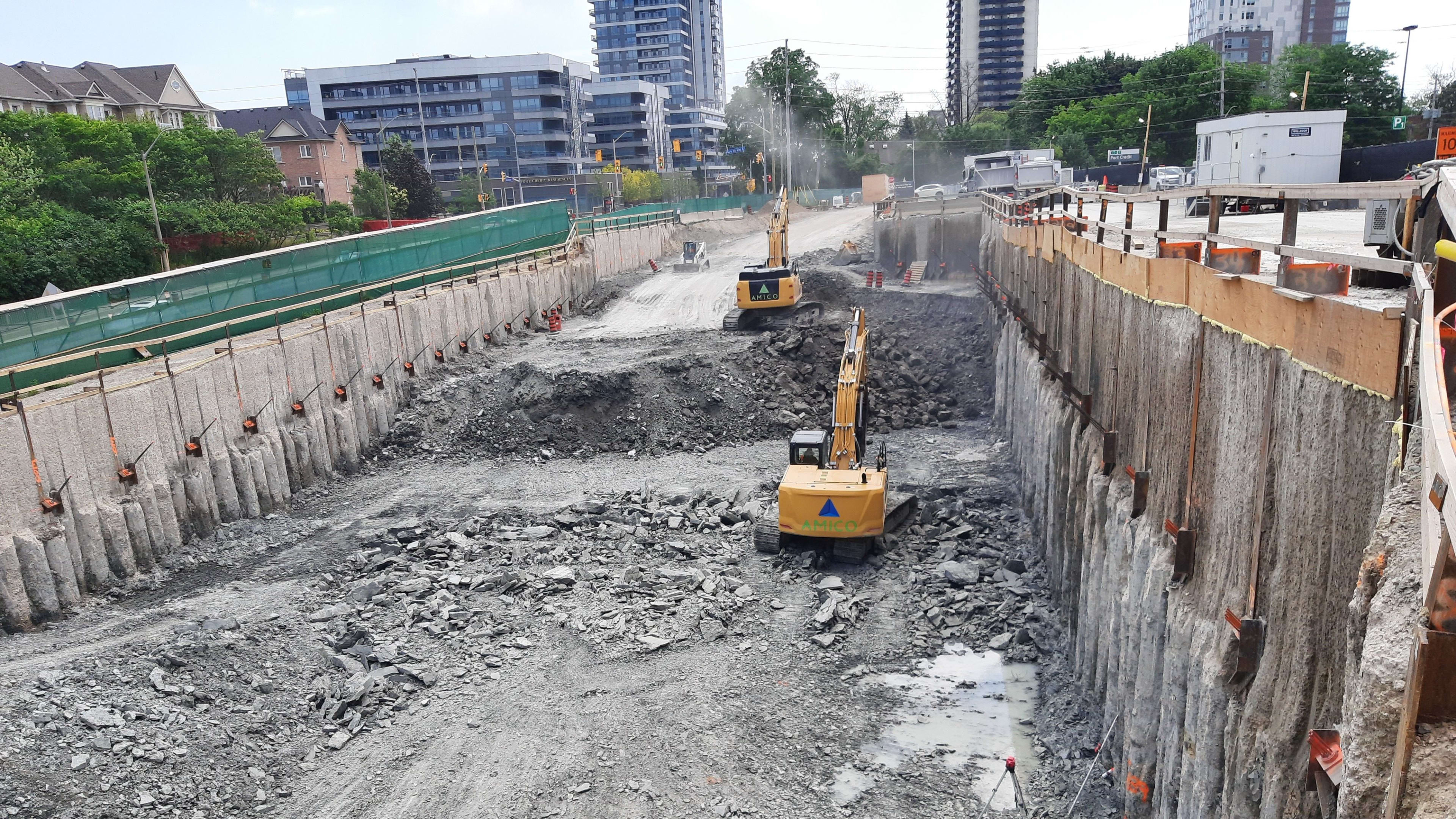 Excavators making progress on the Hurontario LRT project construction at Port Credit GO