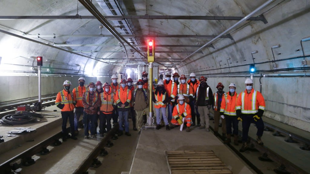 group of people standing with signal