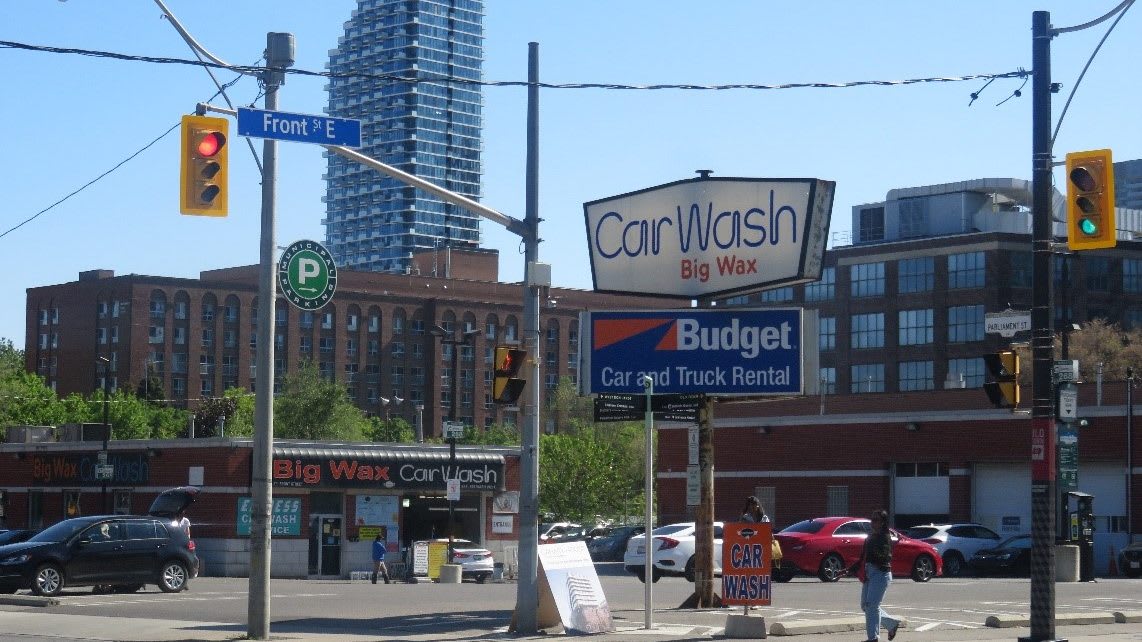 the parking lot with businesses around.