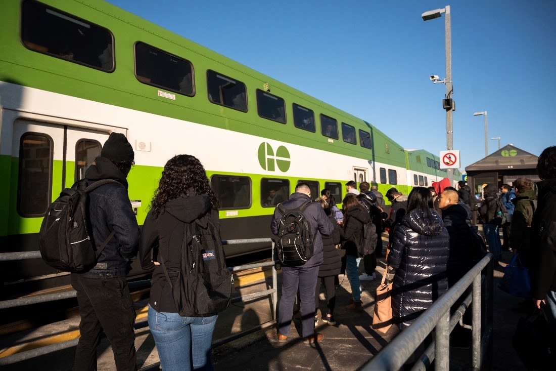 Customers prepare to board a GO Train at Maple GO