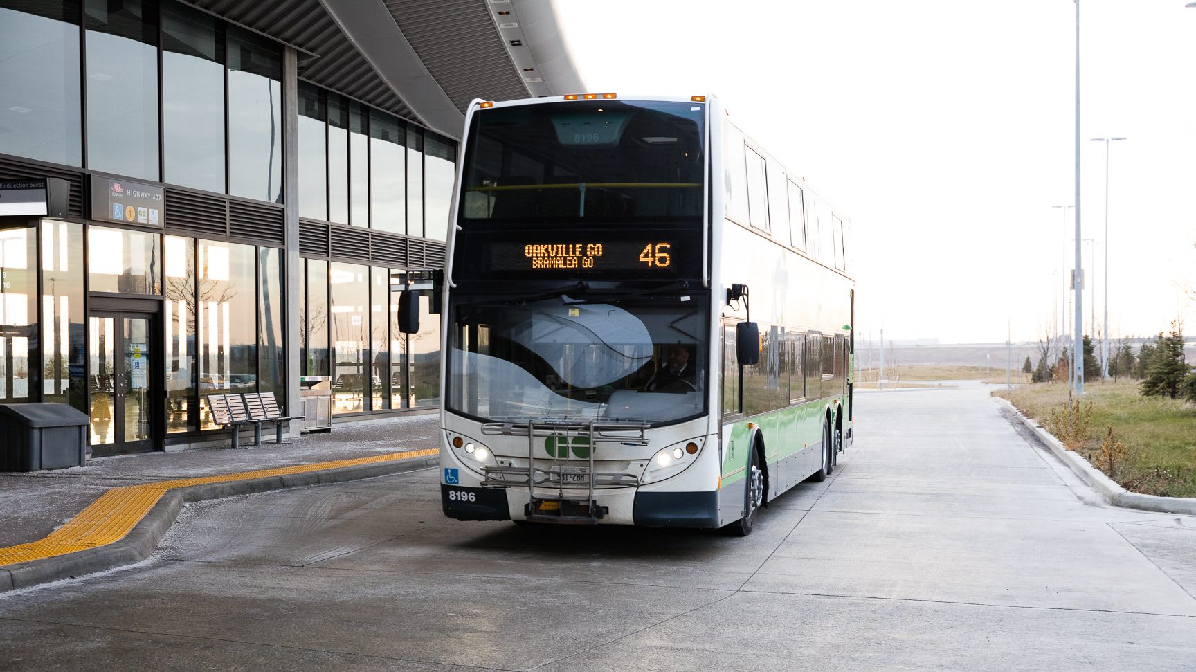 a go bus pulling out of a station