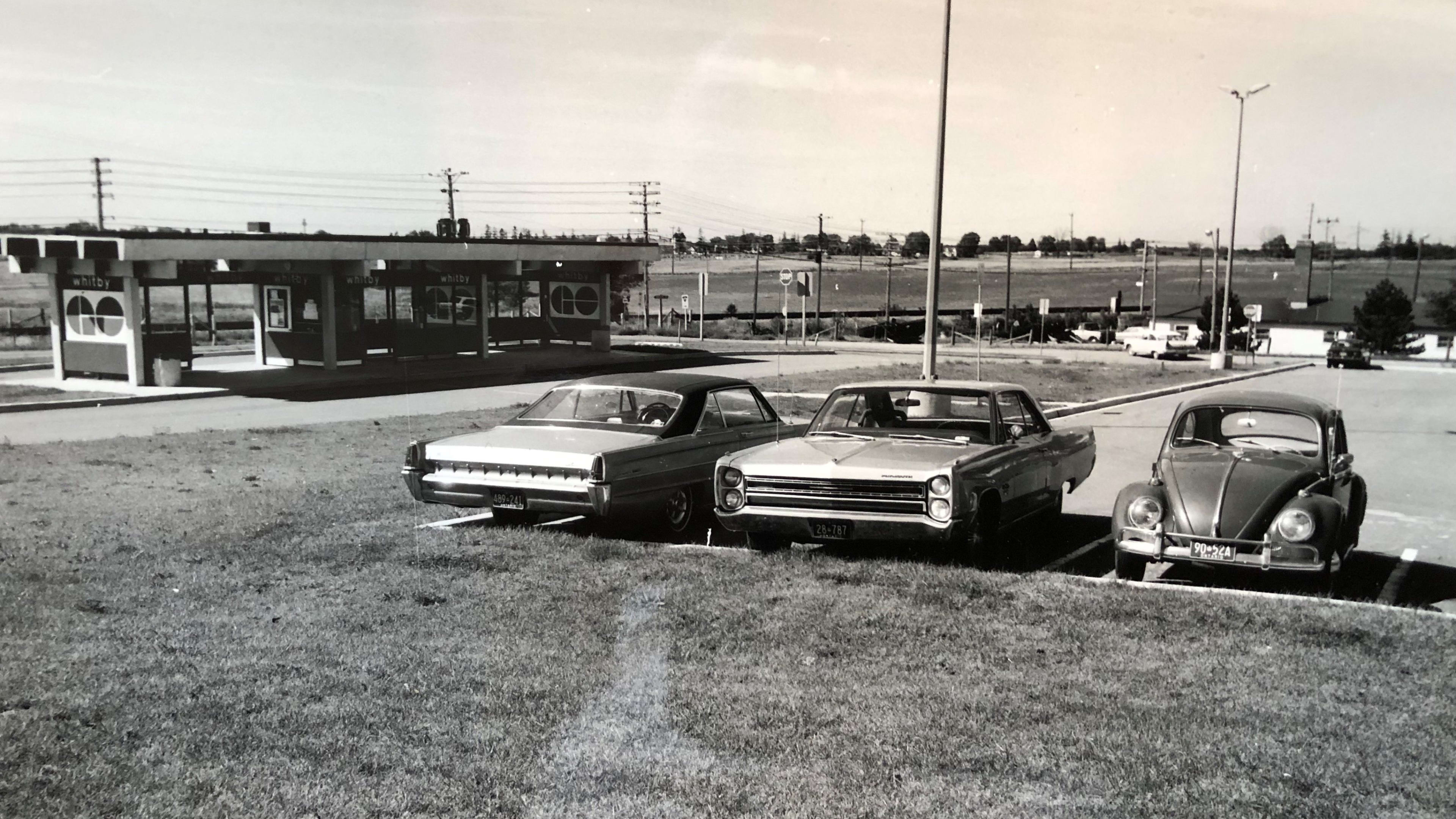 Cars park at a GO station in this 1971 image.