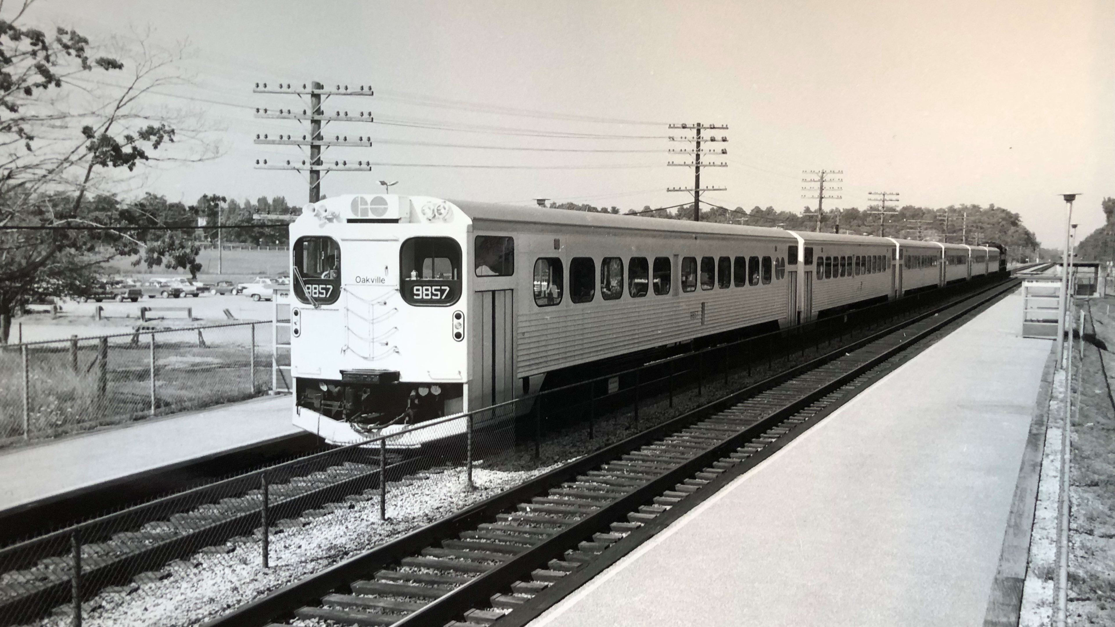 A GO train is seen moving along a section of rail.