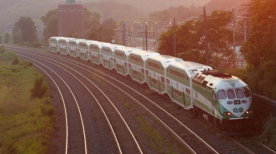 A GO Train travels through Toronto on the Lakeshore West Line