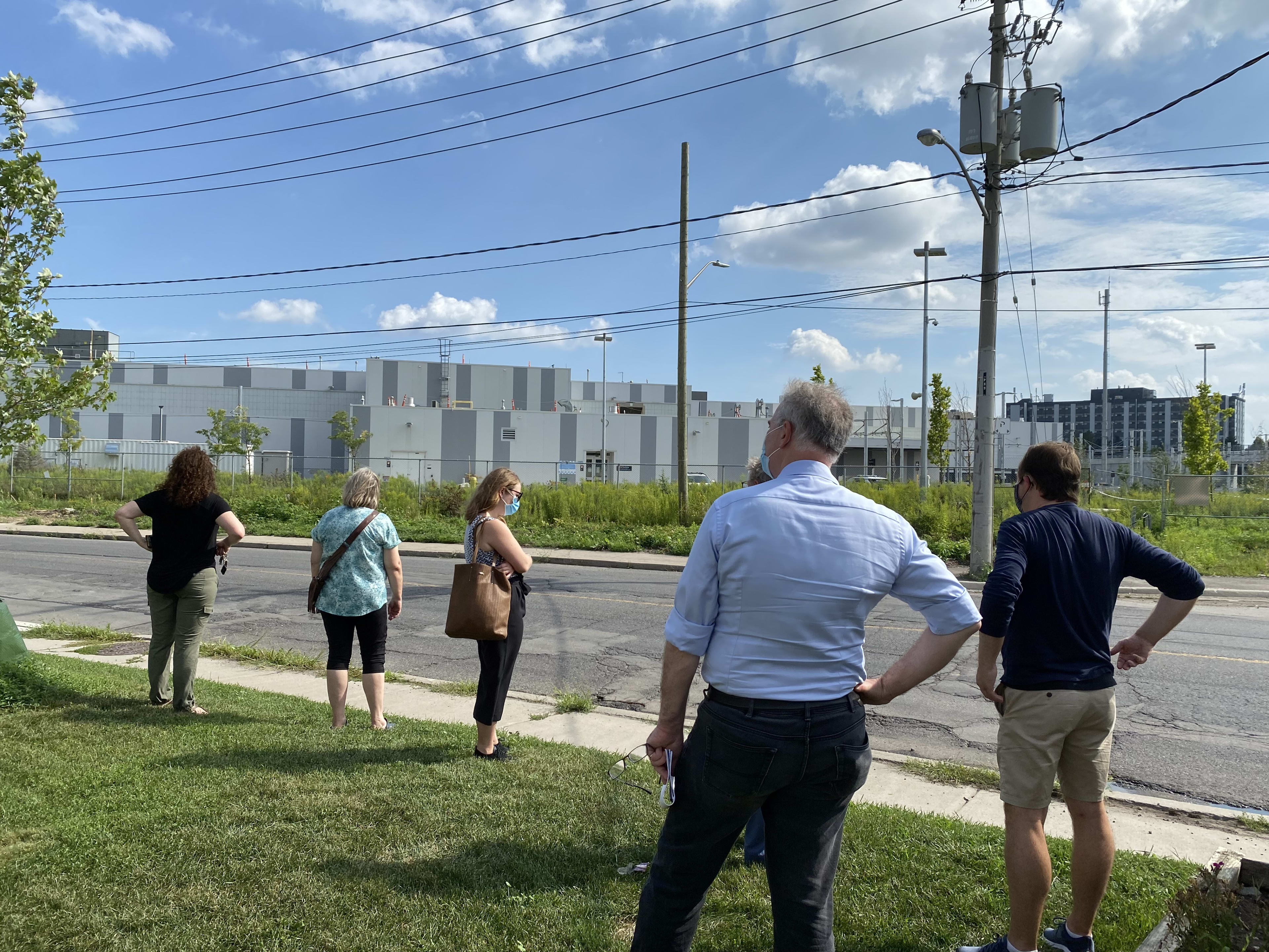 People look at a building.