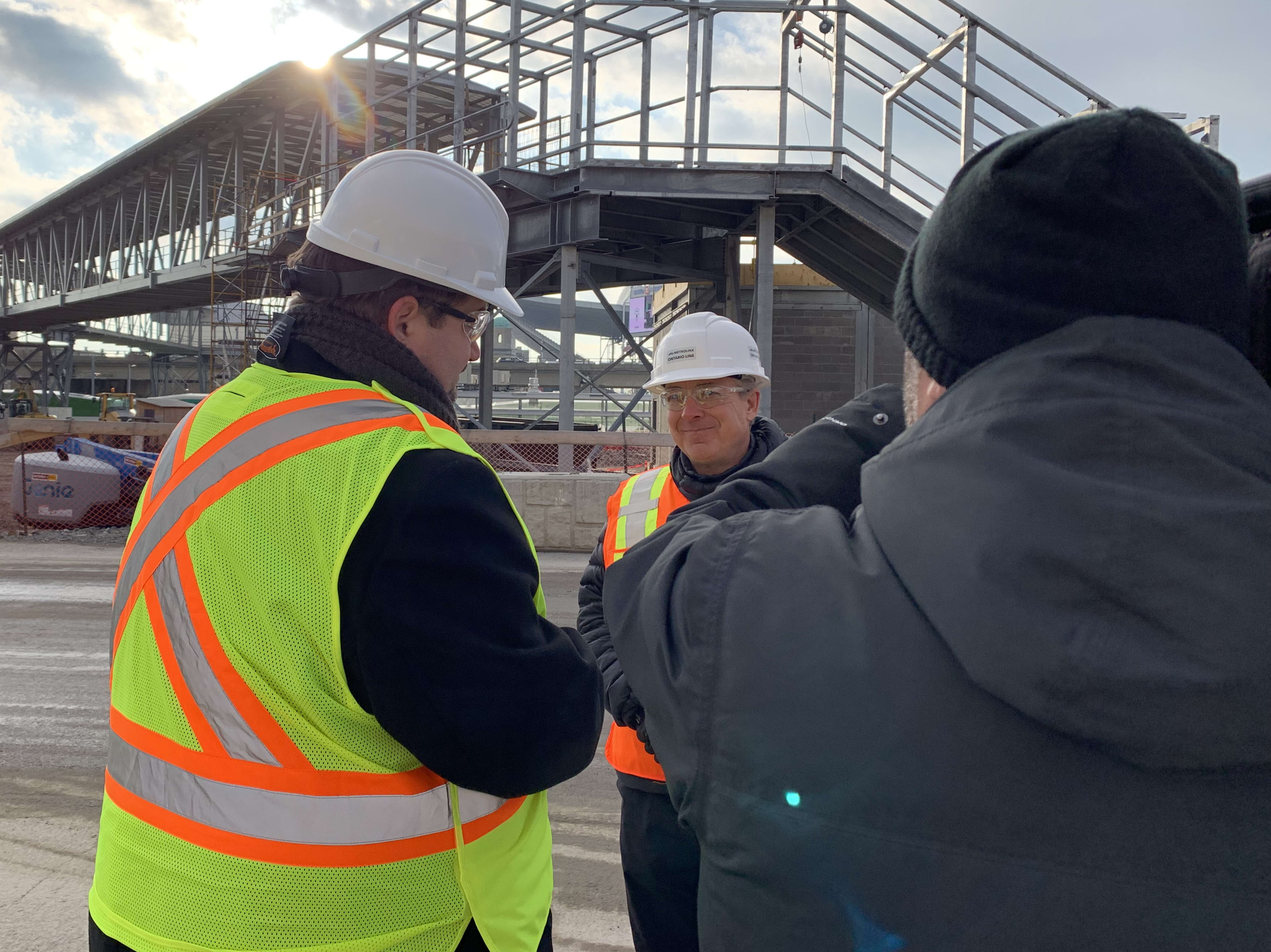 Ontario Line program sponsor Malcolm Mackay being interviewed by media at Exhibition Station