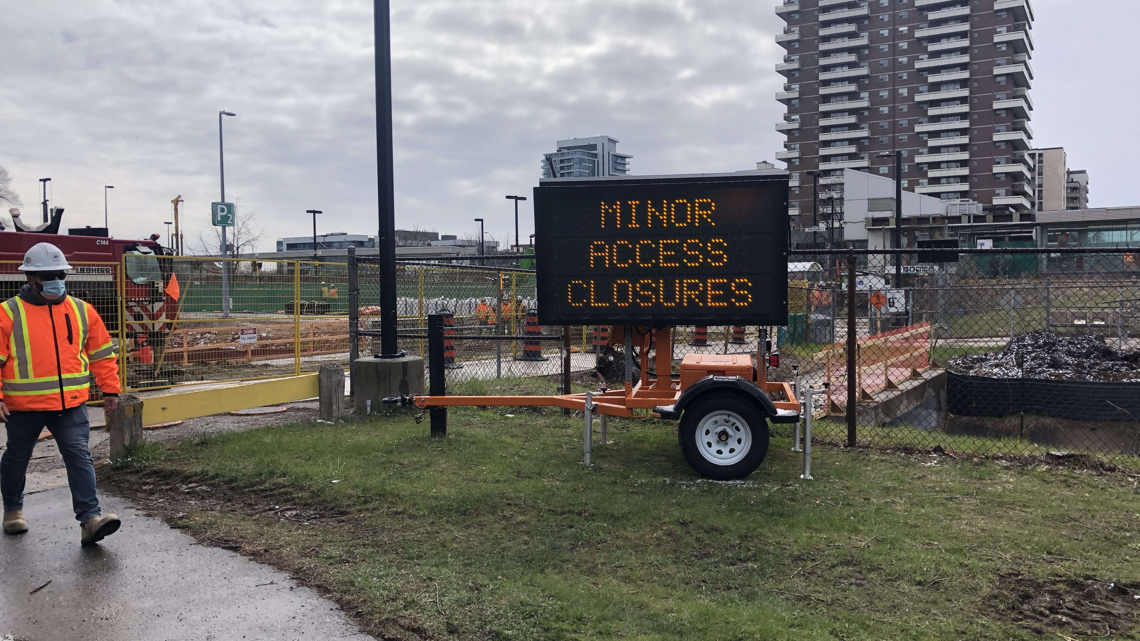 a sign says minor access closures near the construction at Port Credit