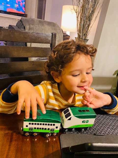 Kid playing with toy train