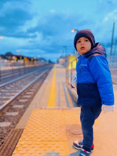 Little boy waiting for train