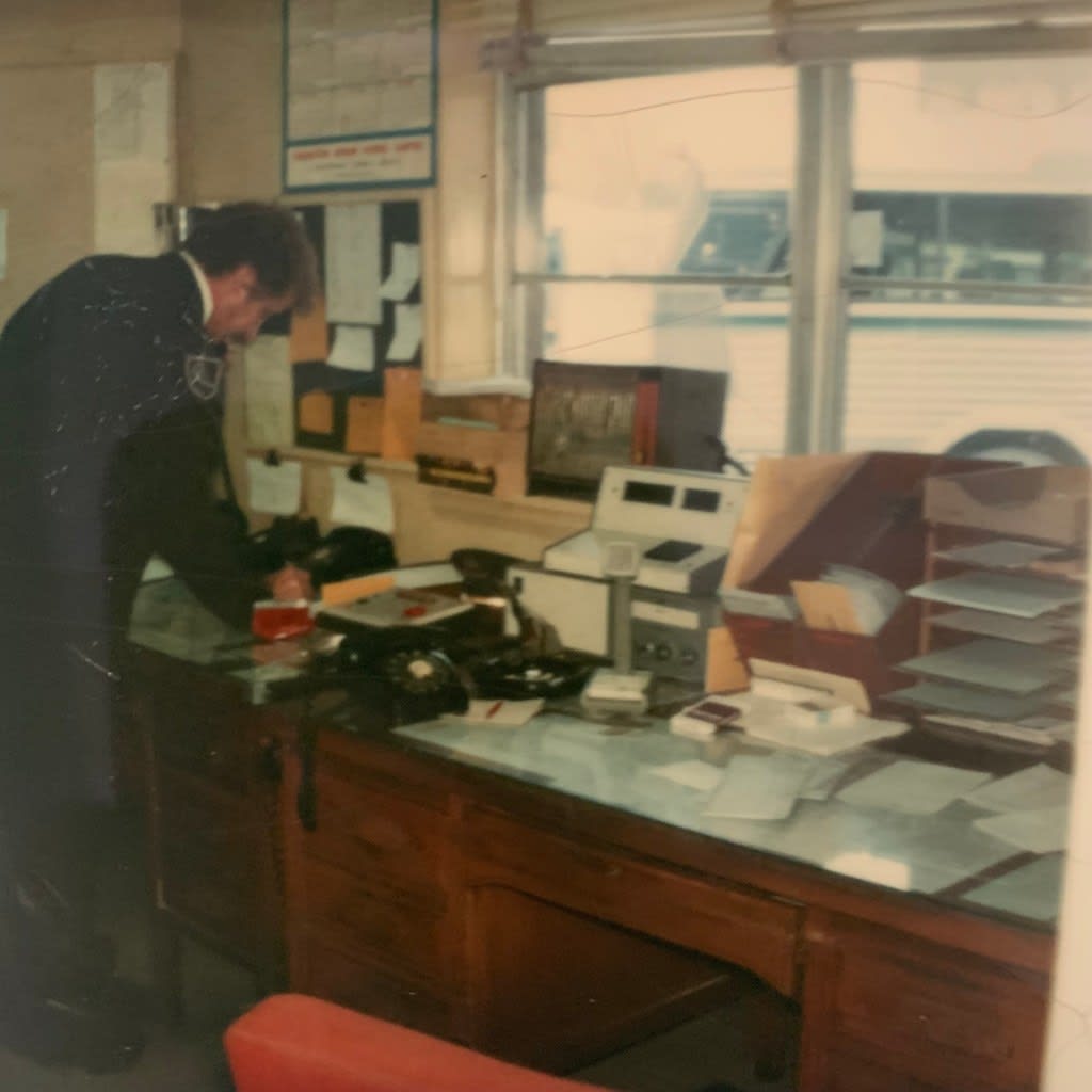 A dispatcher works at his desk.