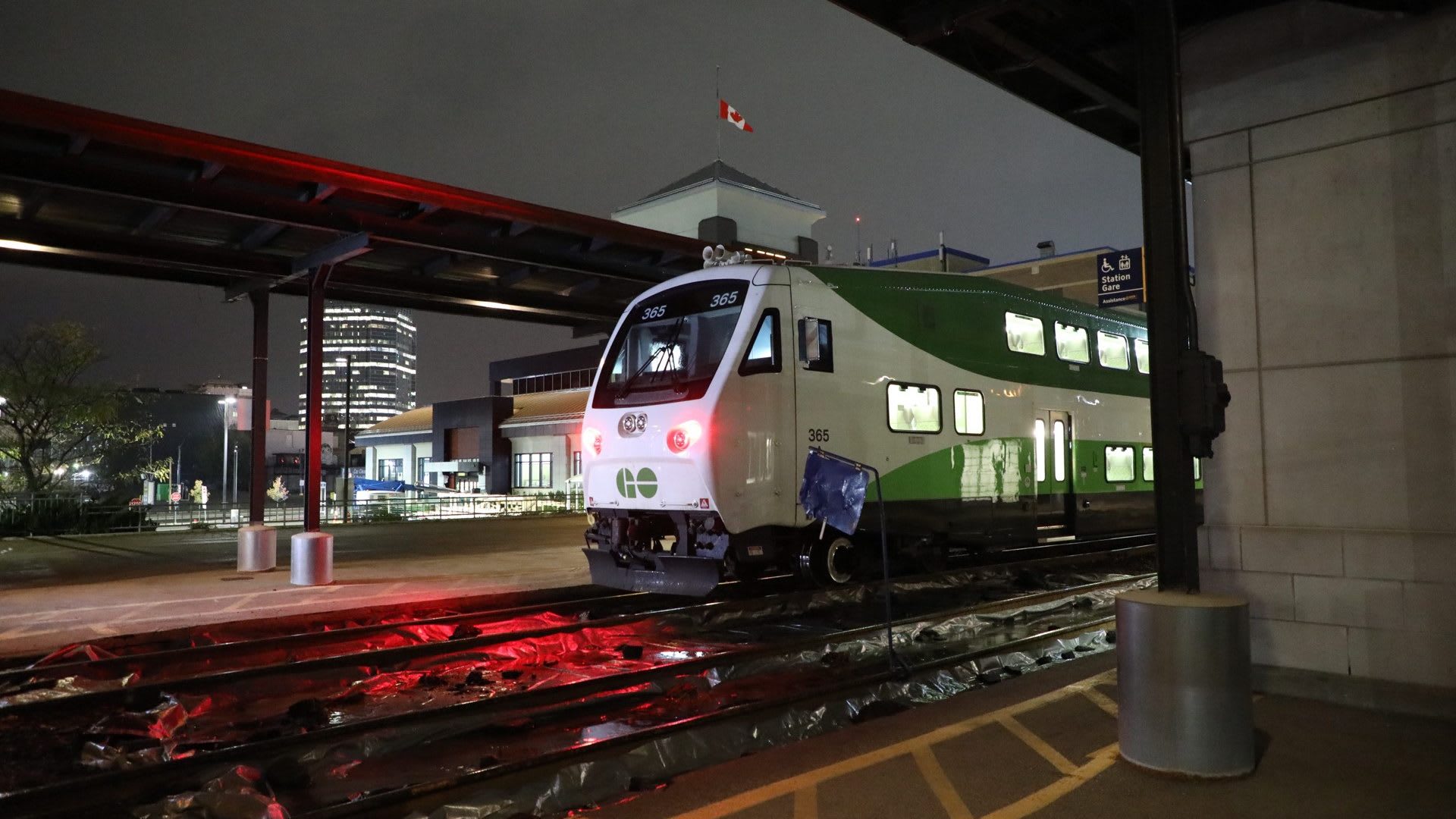 A GO train is shown in the darkness.
