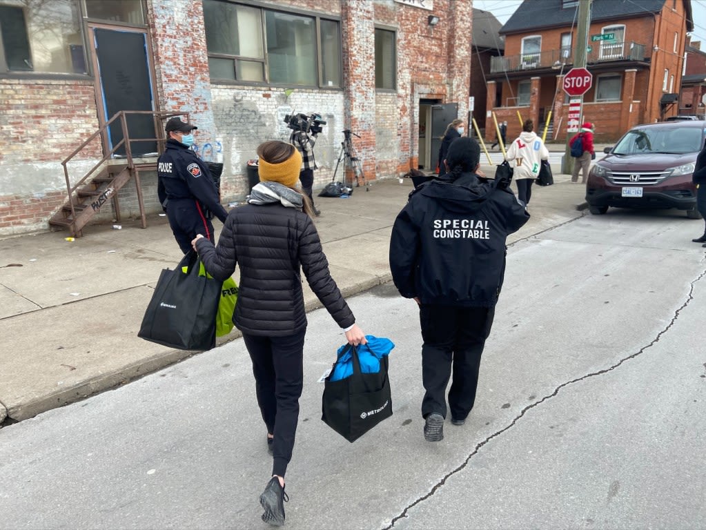 people carrying bags into the facility.
