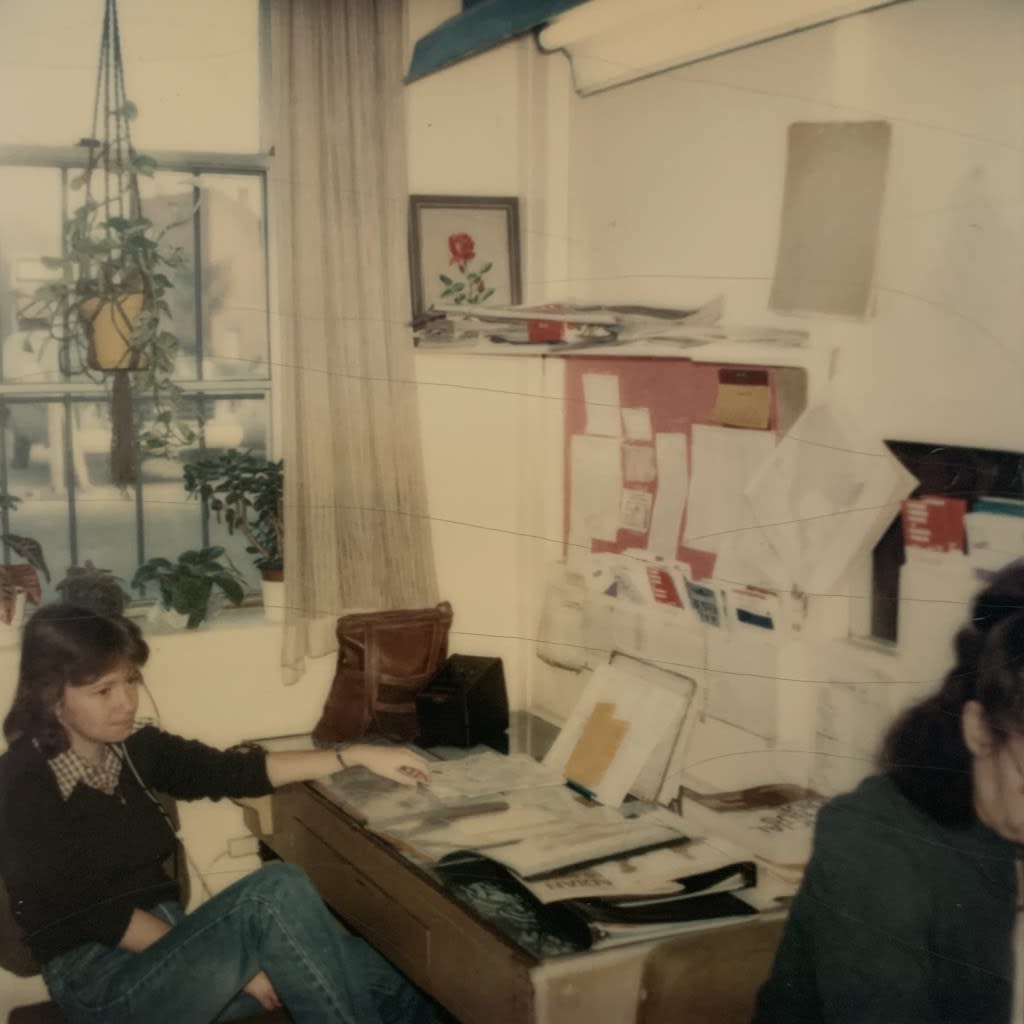 An employee sits at a desk.