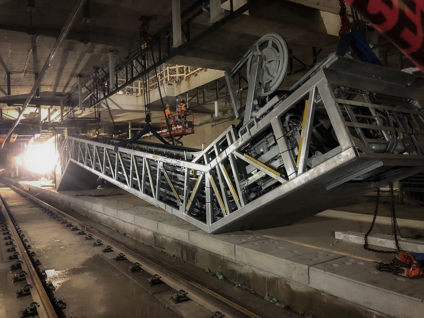 crews working on an escalator