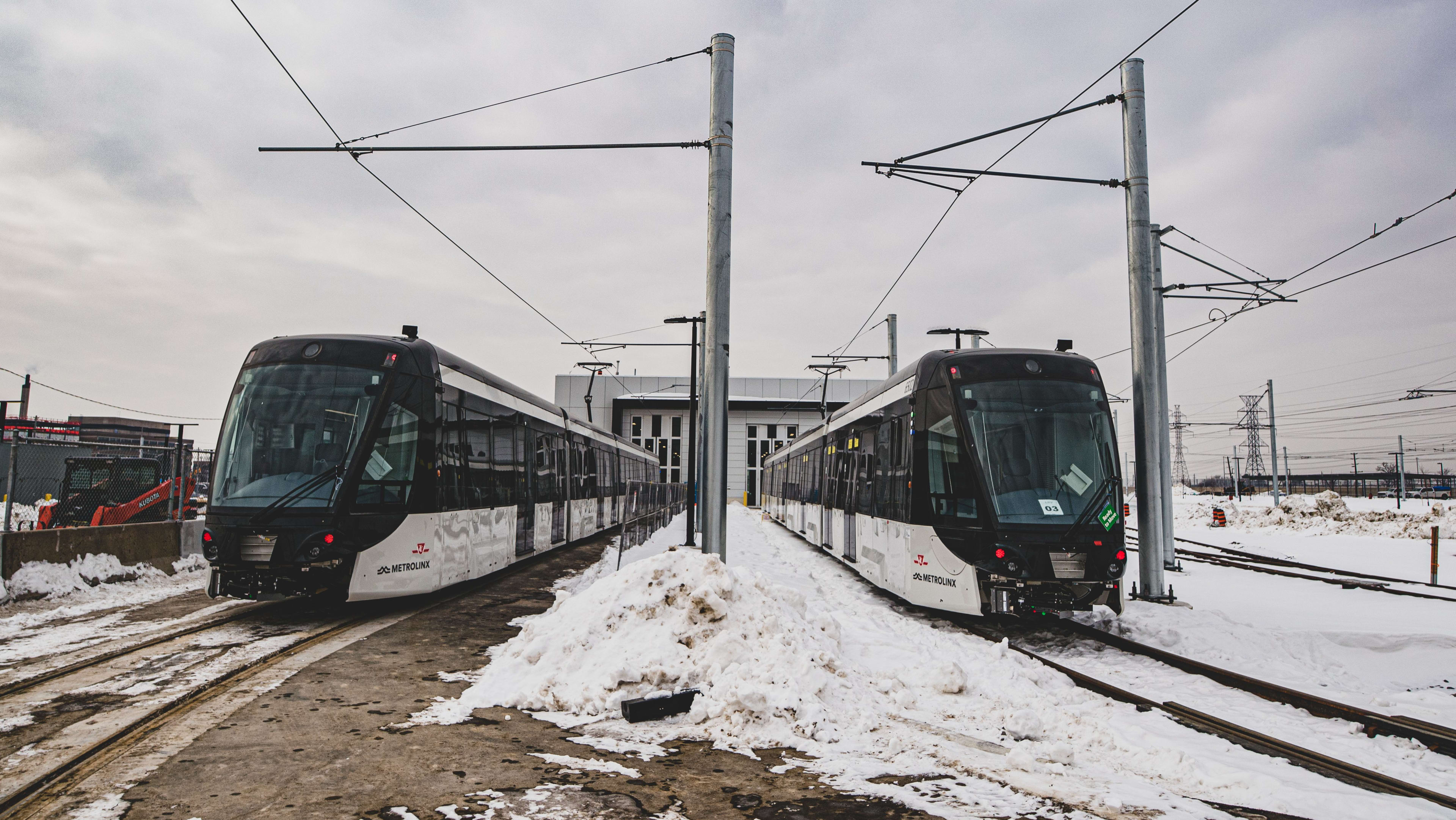 two LRVs in the yard being tested with snow on the ground