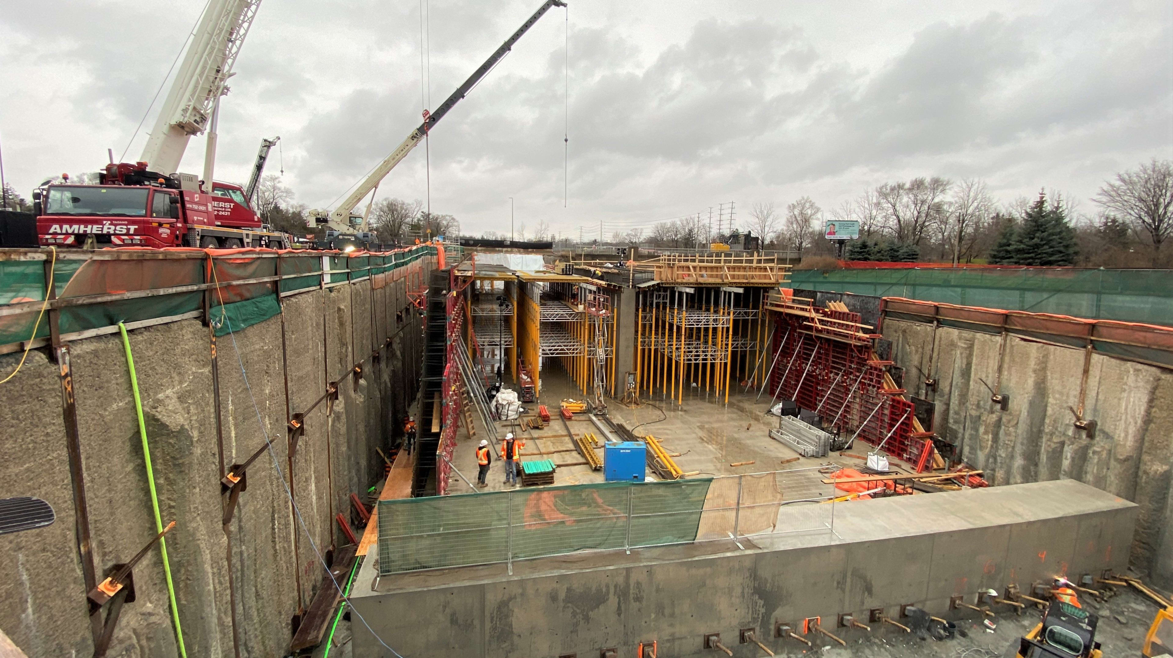 crews working in a concrete pit