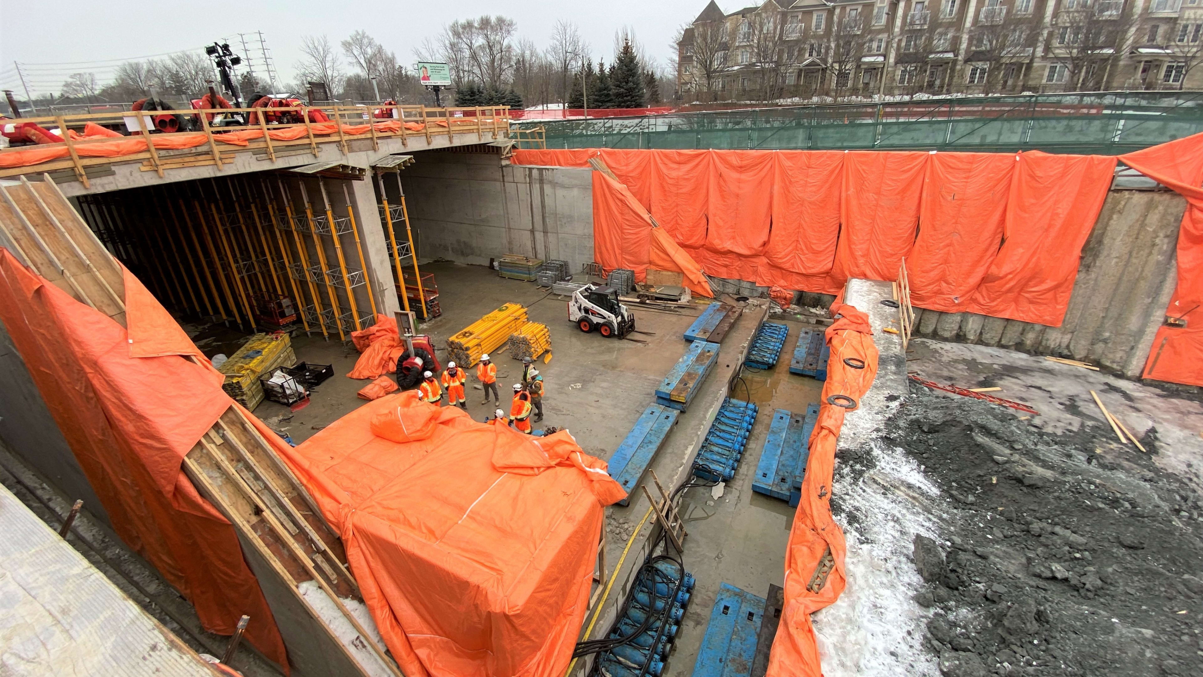 orange blankets on the concrete at a construction site