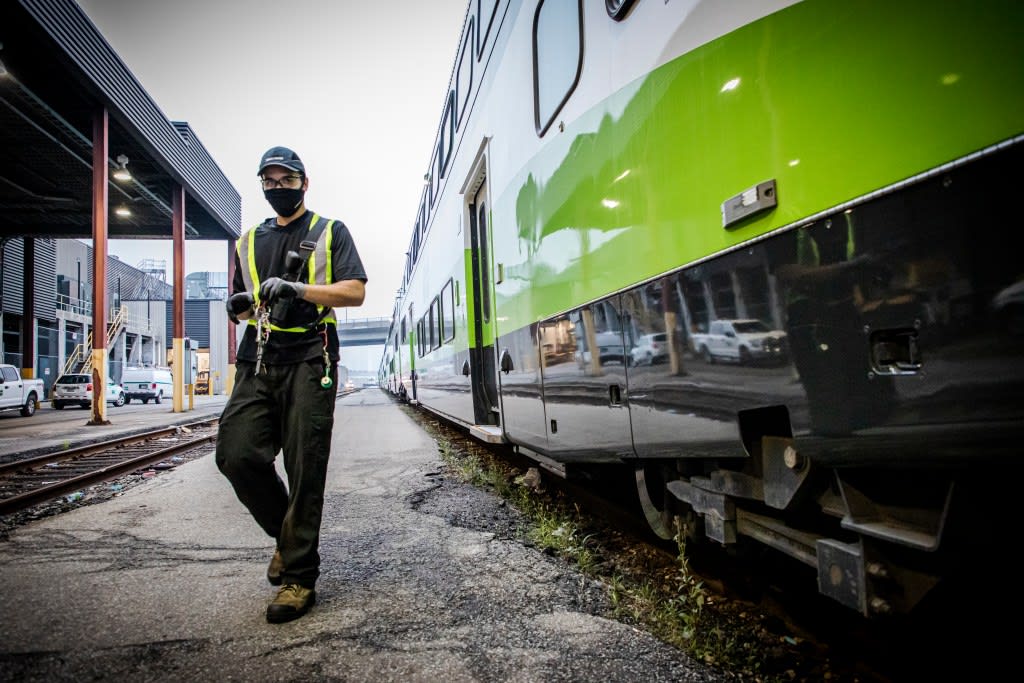 A stock image of a maintenance worker at the GO Transit yard in Toronto.