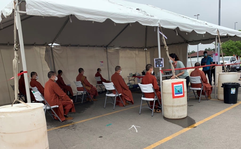 monks under a tent