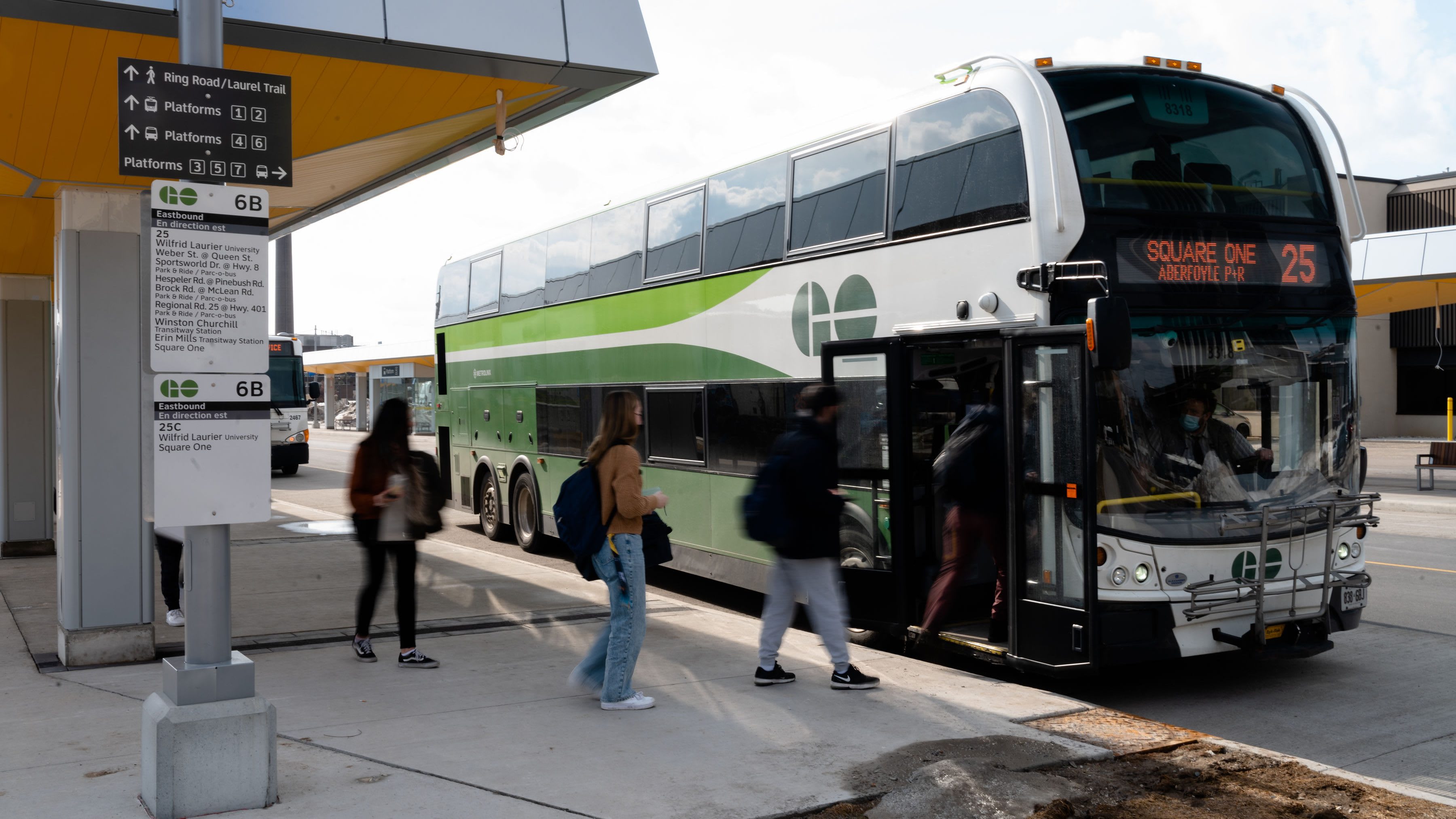 GO Bus pictured at the new University of Waterloo Transit Plaza with customers boarding