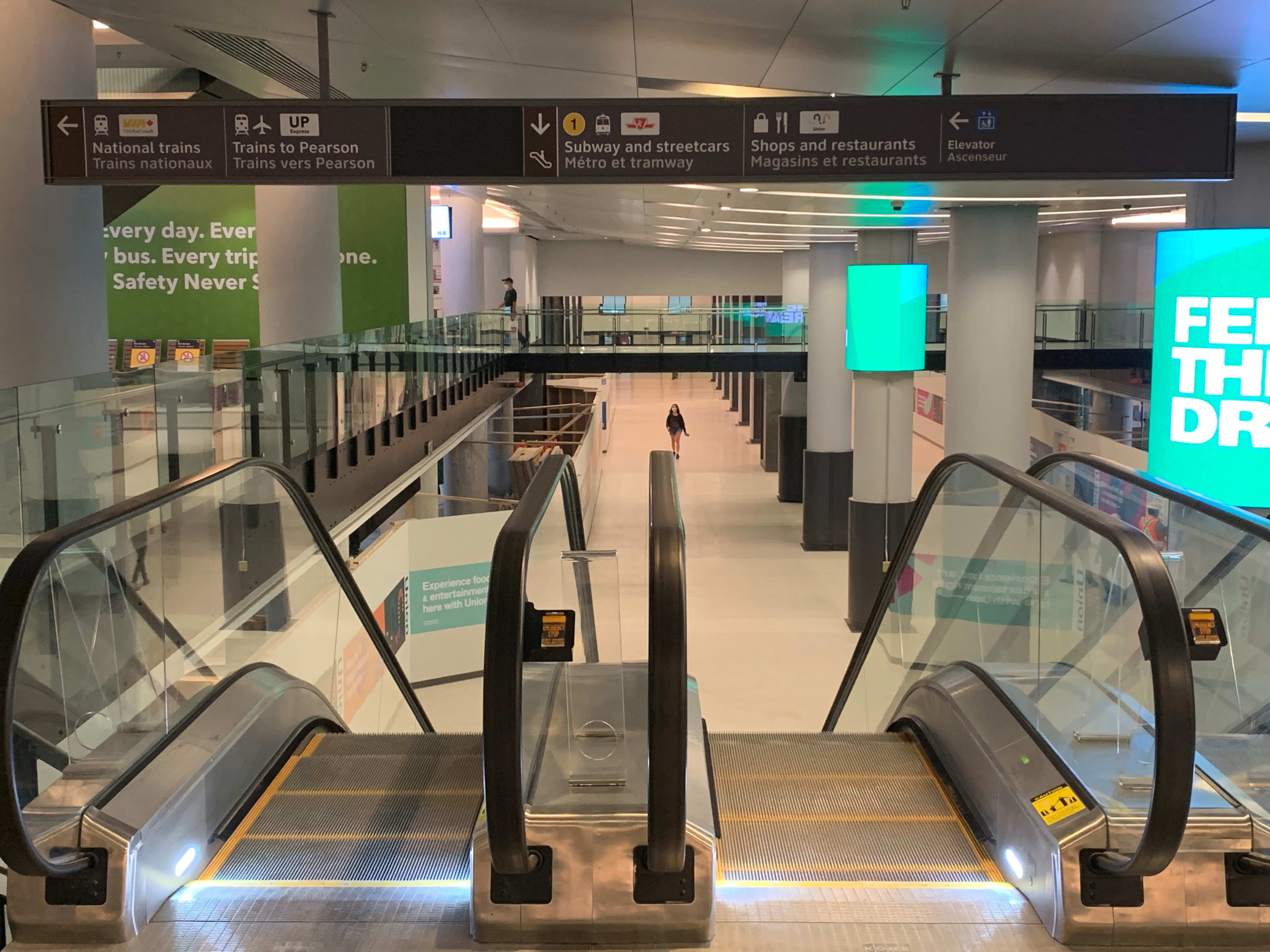 transit signs and an escalator