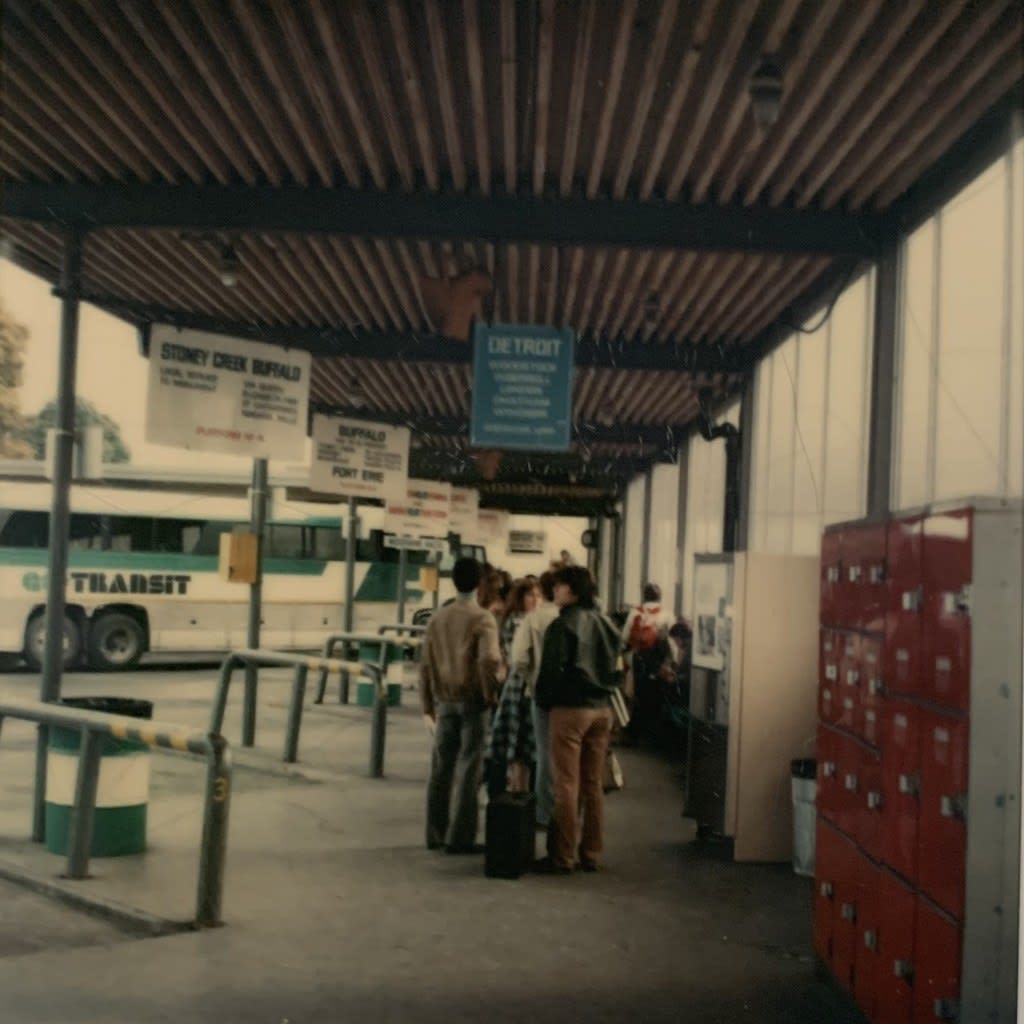 People are in a line waiting to board a bus.