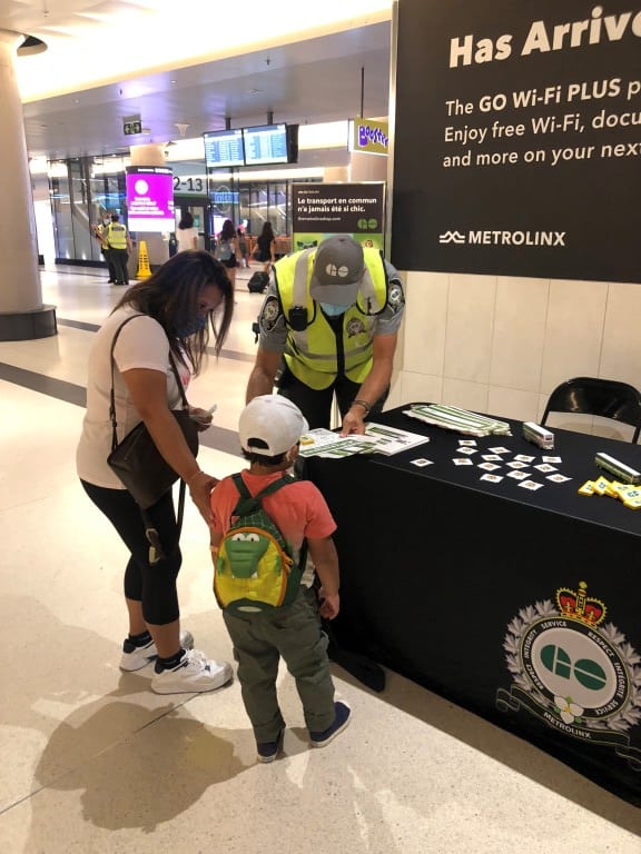 a youngster and mom talking to a GO Transit expert.