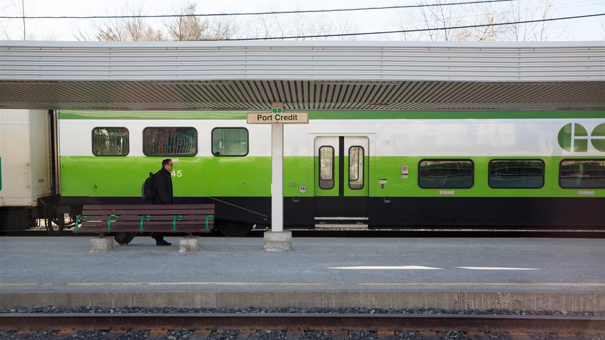 A customer walking along the platform at Port Credit GO - taken before COVID-19 restrictions