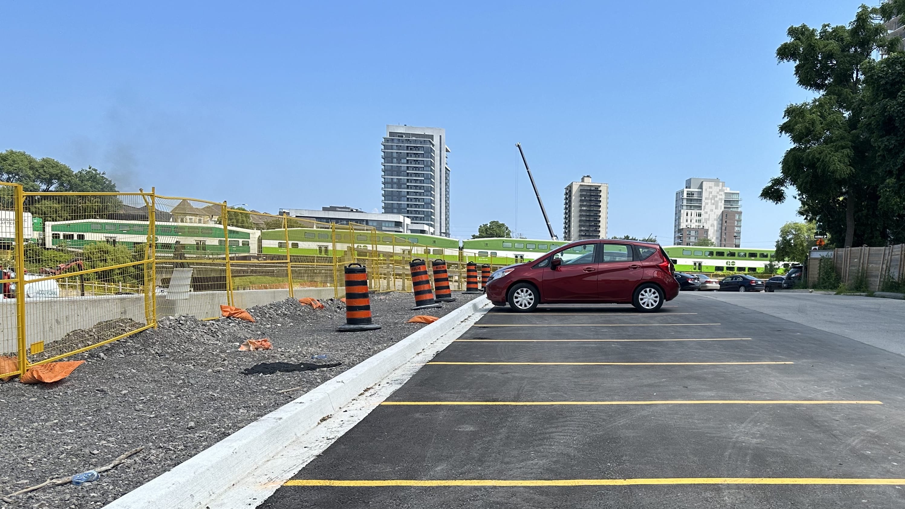 A car is parked in the lot at Port Credit GO.