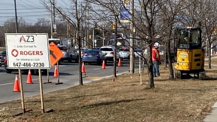 This work crew is using a direction drilling technique to move fibre optics cables for Rogers Com...