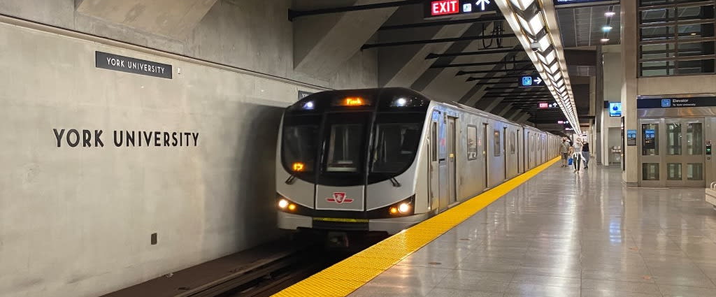 a subway train arriving at the station.